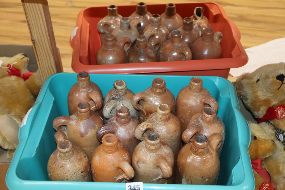 Twenty three Dutch stoneware gin bottles